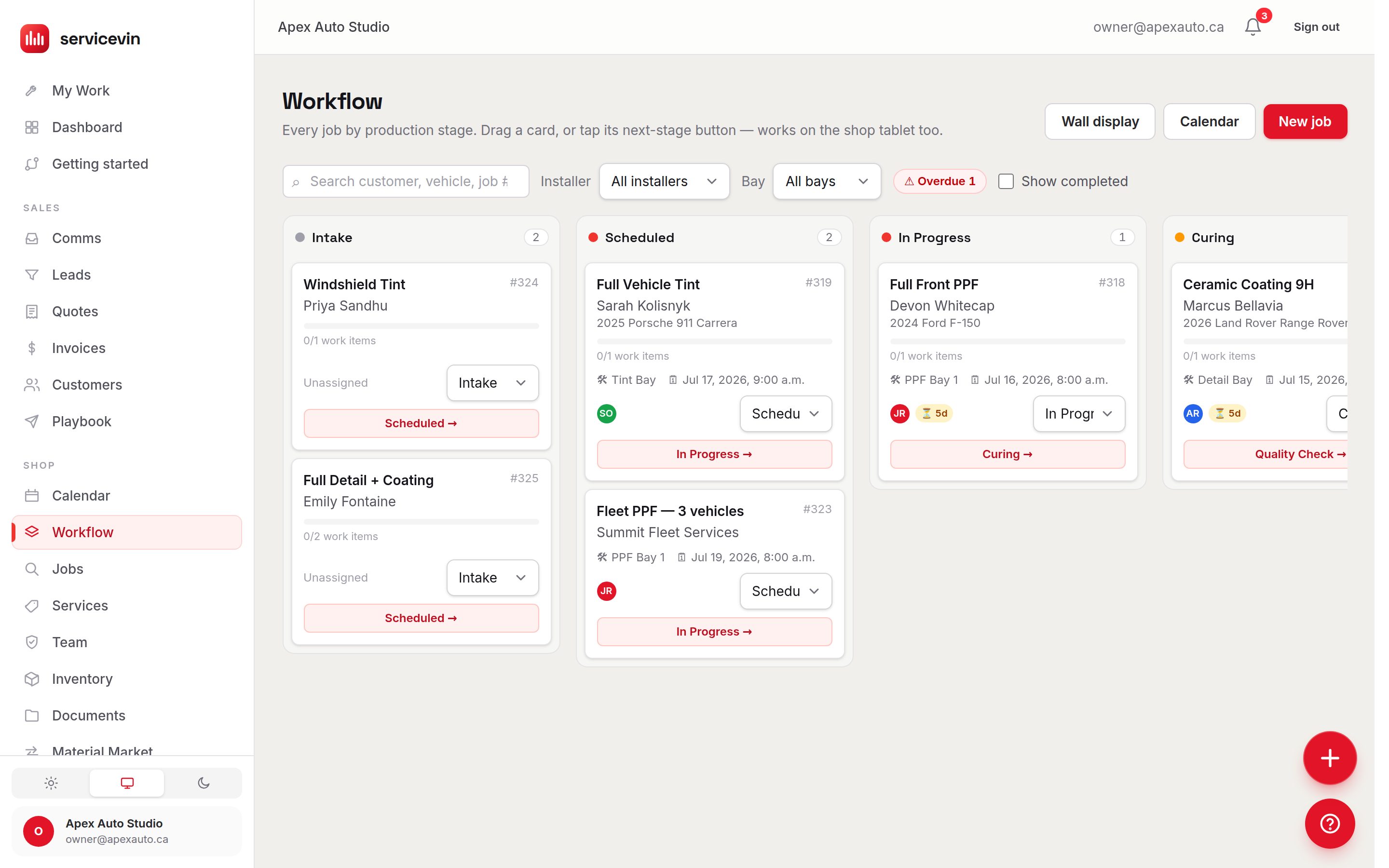 The job board with Intake, Scheduled, In Progress and Curing columns, each job card showing its customer, vehicle, bay and next-stage button